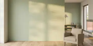 Salon rénové avec mur peint en vert sauge, illustration du guide des prix peinture dans le Var par BL Peinture Rénov
